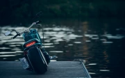 Mysterious Motobike on Lake Dock: Spirit of Travel