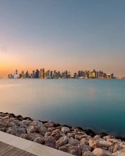 Pastel Sunset Over Doha: Modern Cityscape