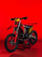 Freedom and Style: GasGas EC 300 GP on a Bright Red Background