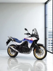 Honda XL750 Transalp: Freedom and Dynamics on a White Background
