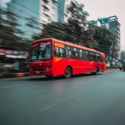 Red Bus in Urban Dynamics: Energy of Transport