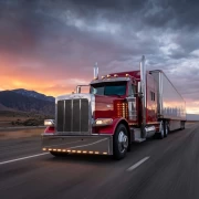 Sunset Majestic Peterbilt: Red Truck Against Sun