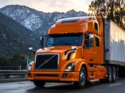 Volvo's Greatness: Orange Truck Among the Mountains