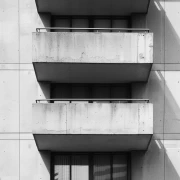 Concrete Balconies: Urban Harmony in Minimalism and Shadows