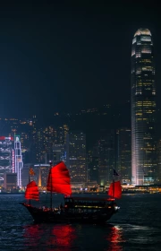 China at Night: City Skyline and Red Sails