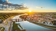 Sunset over the River and the Old Town of Lithuania: Tranquility and Atmosphere of the Country