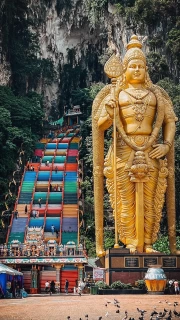 The Majesty of the Golden Statue at the Staircase of Batu Caves, Malaysia