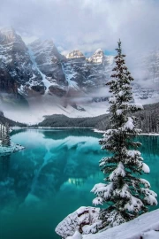 Alaska's Grandeur: Snow-Capped Peaks and Turquoise Lake USA