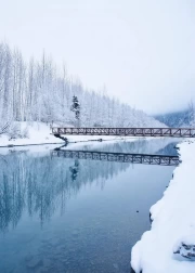 Wooden Bridge Over Mirror River: Snowy Silence of Alaska