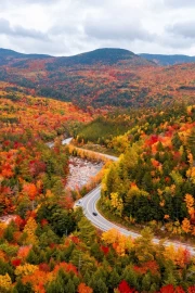 Autumn Hills of Vermont: A Winding Road in the Warmth of Nature