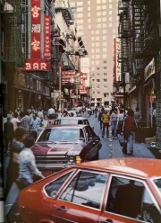 Urban Bustle of the 80s: Bright Signs and Retro Cars