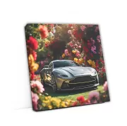 Sleek Gray Aston Martin Vantage Amidst Flowers - Elegance in Motion