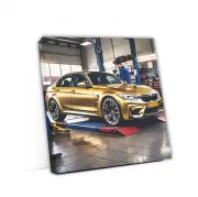 Gold BMW M3 in Auto Service - High Performance Icon