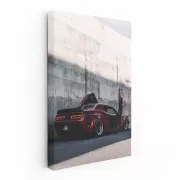 Red Dodge Beside Concrete Wall - Bold and Powerful Ride