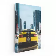 Urban Adventure: Yellow Mustang Roars Through Cityscape