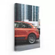 Porsche Macan S in Orange Amidst Skyscrapers - Urban Elegance