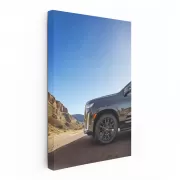 Sleek Black Cadillac Navigates Mountain Roads - Powerful Elegance