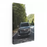 Sleek Black Cadillac Cruising Highway - Elegance in Motion
