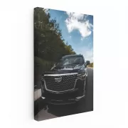 Sleek Black Cadillac Cruising Road - Elegance in Motion