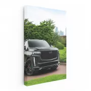 Black Cadillac Overlooking Cityscape - Elegance in Motion