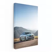 Majestic Cadillac Amidst Mountain Peaks - Symbol of Luxury