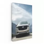 Majestic Cadillac Among Mountain Peaks - Power and Elegance